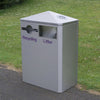 White dual trash bin with 1 keyhole aperture and 1 standard aperture and a pitched lid. 