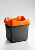 Trash can with open top orange lid and black base color. 