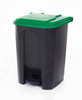 Trash bin with green lid and operated by foot pedal