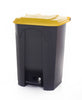 Yellow-topped pedal trash bin