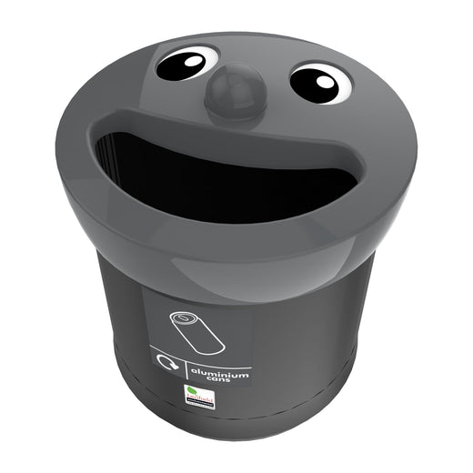 A trash bin with a black body, highlighted by a smiley face, grey lid, and an attached sticker.