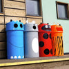 four trash cans, each bearing a different animal's face design - these include a hippo, a ladybird, a mouse, and a tiger.