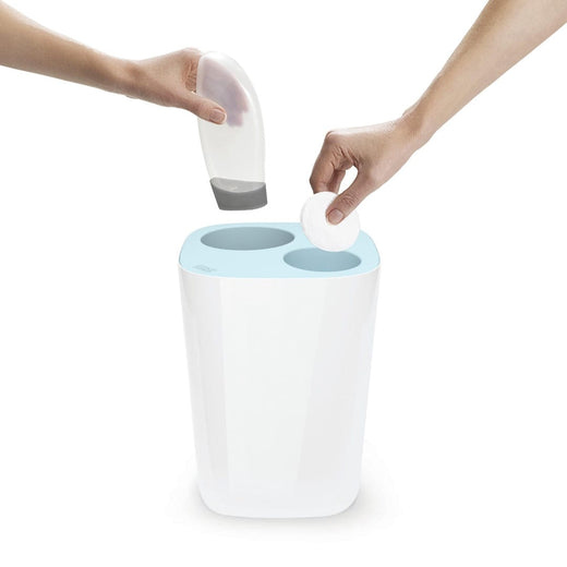 Disposal of cotton pads into the small receptacle and a plastic bottle into the larger receptacle.