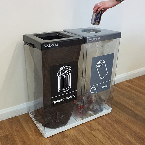 Internal dual compartment recycling bin, transparent bodies with general waste and cans recycling streams.  Showing with liners for reference