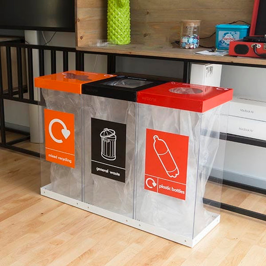 Triple recycling station, showing clear bodies and recycling streams for plastic bottles, general waste and mixed recycling