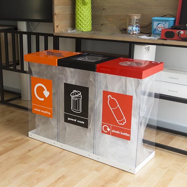 Triple recycling station, showing clear bodies and recycling streams for plastic bottles, general waste and mixed recycling