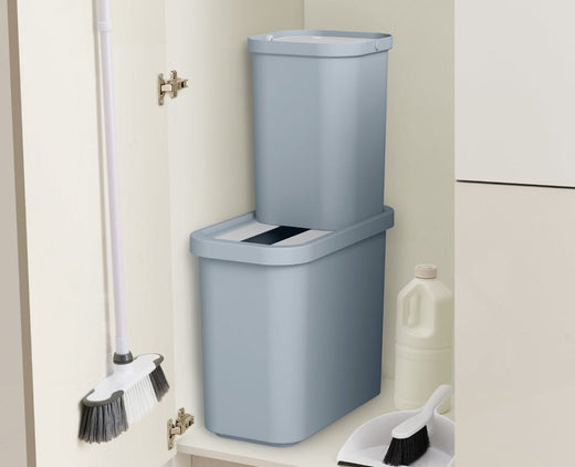 A storage cabinet housing two grey coloured 7-litre trash bin compartments stacked on top of each other.