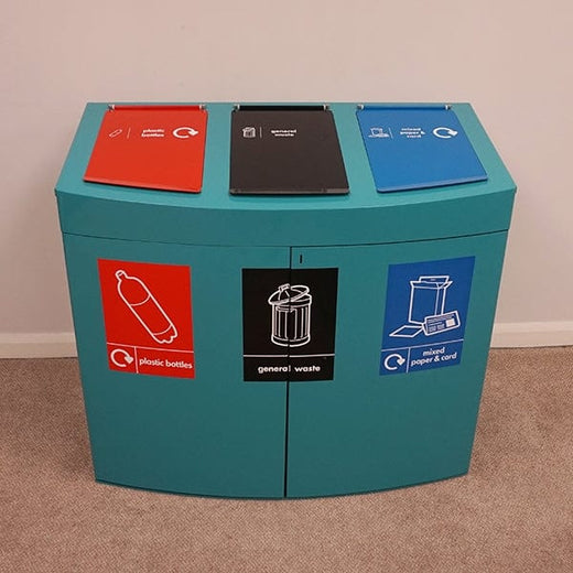 Front facing 3 way console recycling bin sectioned in red for plastic bottles, black for general waste & blue for mixed paper waste.