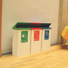 Three bins Sat together with Green, Red and Blue Lids with an 80 Litre Capacity