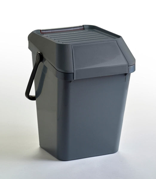 Grey body and grey lid recycling bin with carry handle in the locked position and closed flap