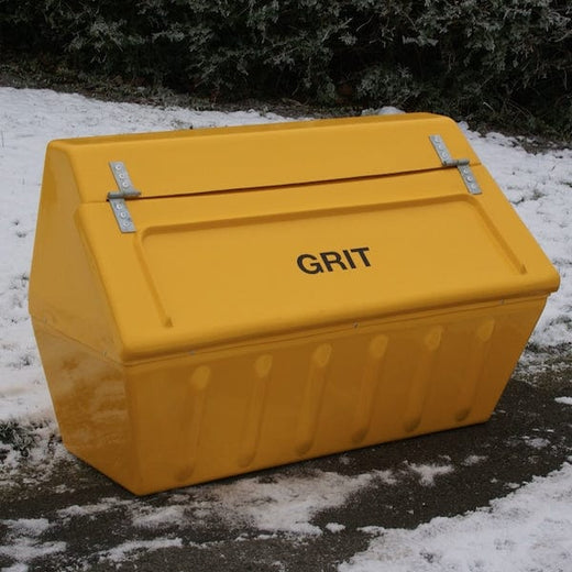 A yellow GRP grit container positioned on an icy road.