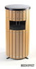 Round freestanding wate bin with beech coloured slats, rectangular aperture to the front and black removable lid