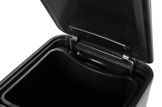 Close up image of the interior of the EcoSlim Bin featuring its stay-open green switch for effortless bag replacement.