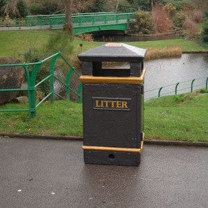 112L Corrosion Resistant Outdoor Litter Bin with an ashtray top, set in a park.