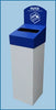 Recycling bin with white base color and blue lid. It has paper shape aperture and a recycling label on top.
