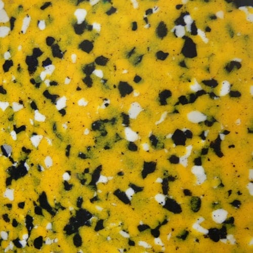 A detailed view of the recycled plastic chippings, displaying a variety of colors including white, black, and yellow.