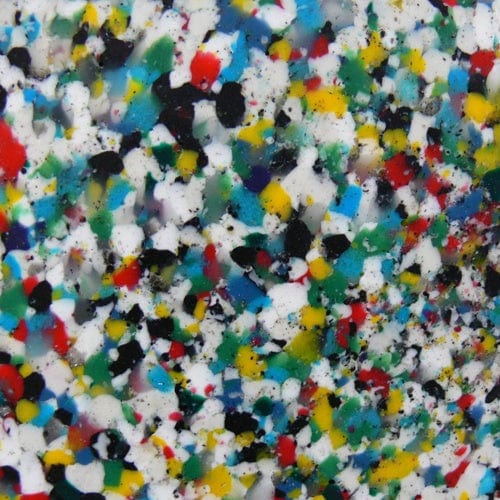 Close up view of the recycled plastic chippings. It has various colors of white, black, green, red, and blue.