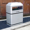 Titanium finish litterbin with bin peaked lid and ashtray, open apertures and black banding.  Wording Litter in black laser cut text