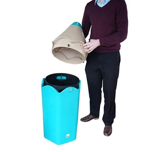 A man removing the hooded top from the pencil litter bin. A plastic liner is visible from the inside. 