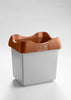Open-top garbage bin with a white body and a brown lid for easy disposal.