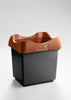 A waste bin featuring an open top, a brown lid, and a black base color.