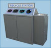 Large 4 bay recycling station with apertyres for 4 different waste streams, complete with sink section for excess fluids.  Recycle station sign above the unit