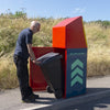 Roadside litter bin with back in the open position with person removing wheeliebin