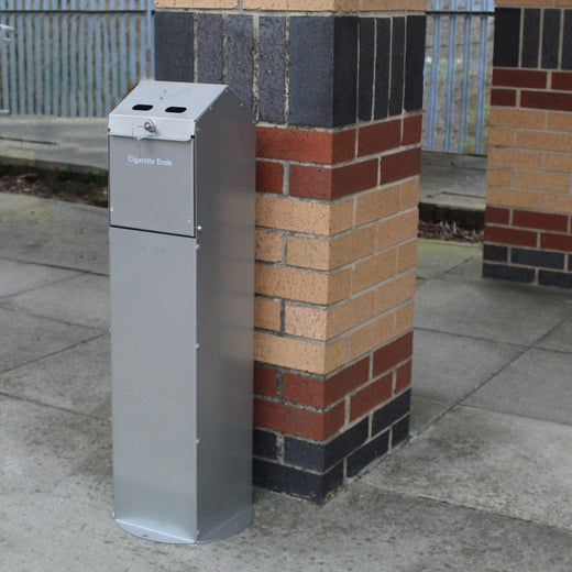 Galvanised steel freestanding cigarette ashtray with 2 small open apertures for disposal and locking mechanism