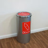 Internal recycling bin showing plastic bottles graphic on the front and the swing lid