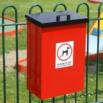 Square dog waste bin, mounted to a fence with red body and black lift up lid.  Complete with clean it up iconography to the front