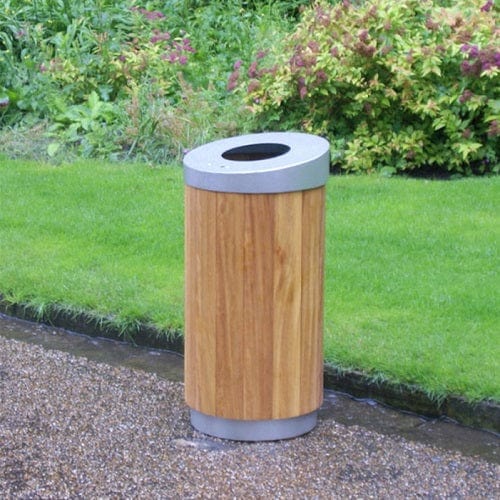 Timber constructed circular litter bin with open top aperture in location
