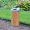 Timber constructed circular litter bin with open top aperture in location